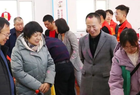 盛世腾龙迎新春· 翰墨传情送福——朔城区新联会与开发路中心社区举办“写春联送祝福进社区”活动